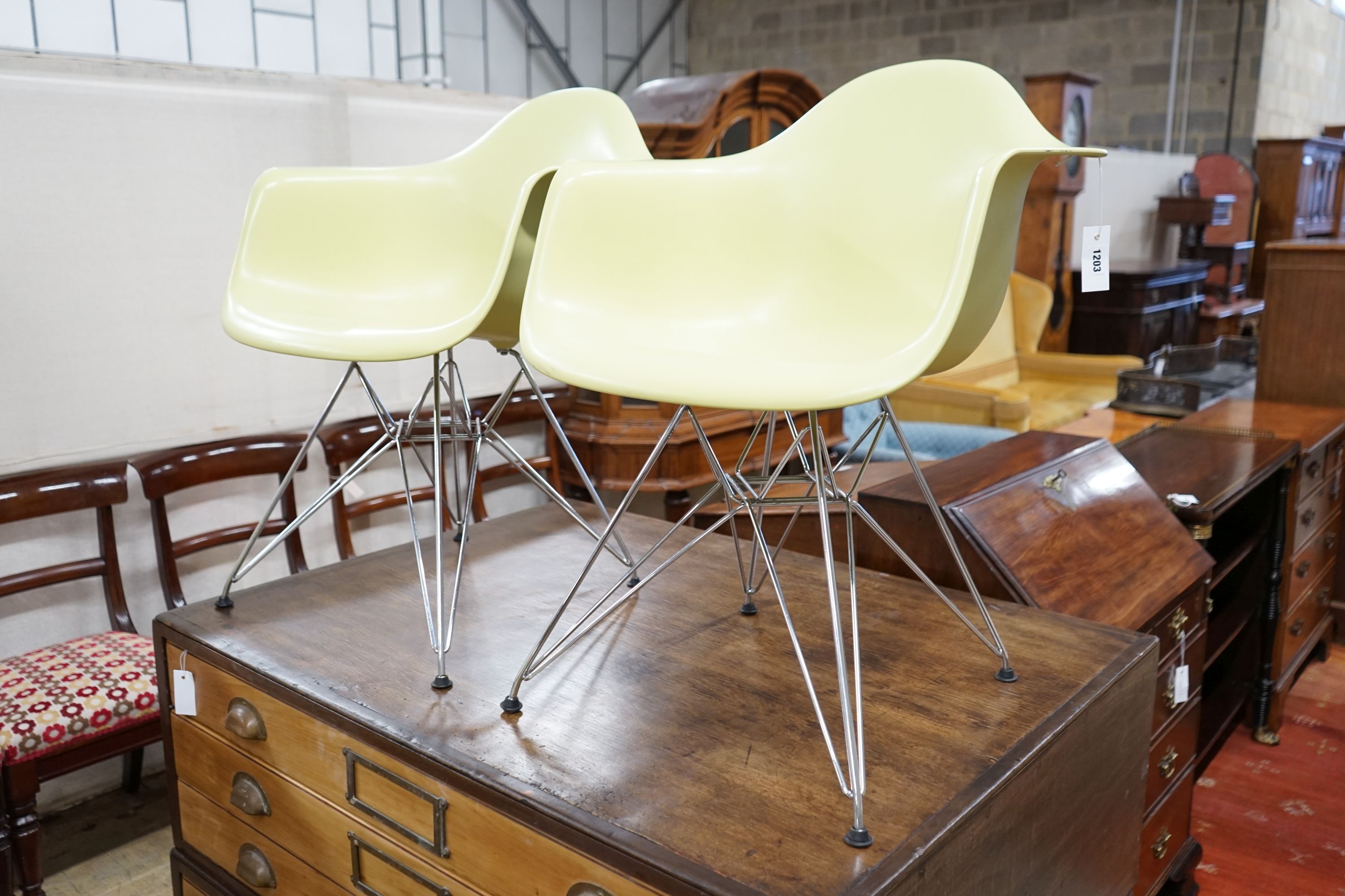 A set of four Eames Vitra aluminium and polycarbonate chairs, width 62cm, depth 48cm, height 80cm